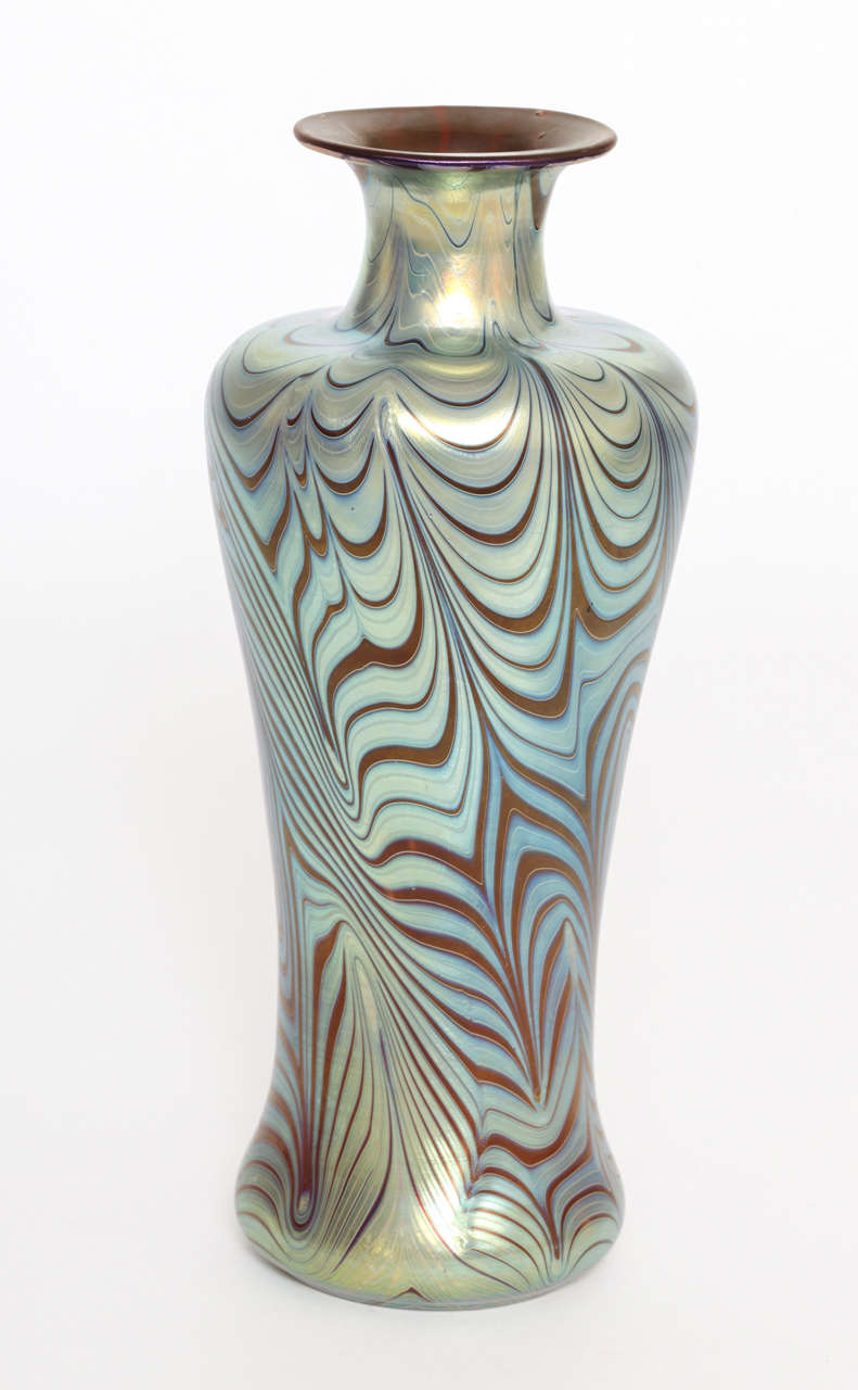 A 10.25 inch tall Loetz Glass vase, handblown and decorated. Unusual 
Form and beautifully executed with the PG 7793 decoration, from 1899.
Mint condition, unsigned.