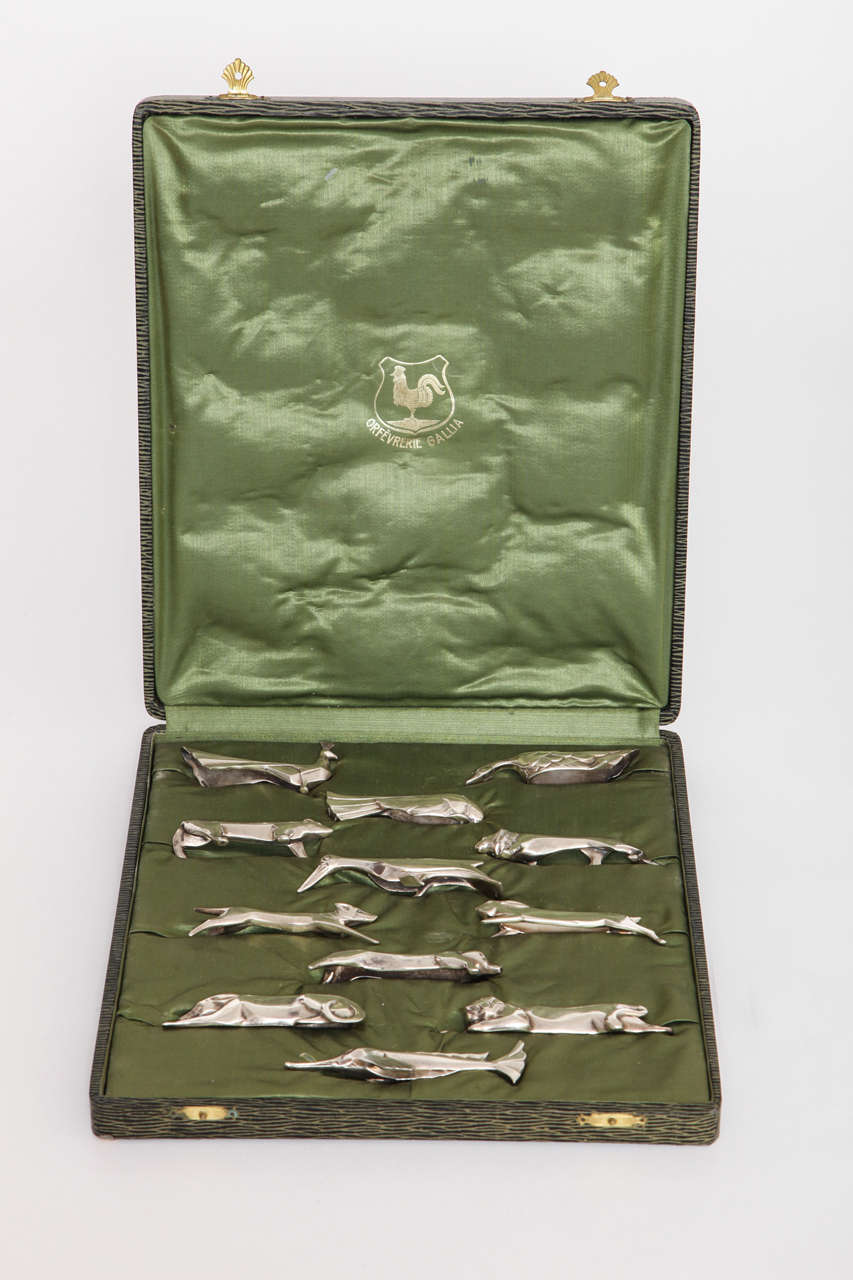 A Set of Twelve Art Deco  Knife Rests in the Original Fitted Box,
France , 1925. The Stylized Set of twelve different animals was made by Gallia and retailed by Christofle. Each piece is stamped: Gallia.