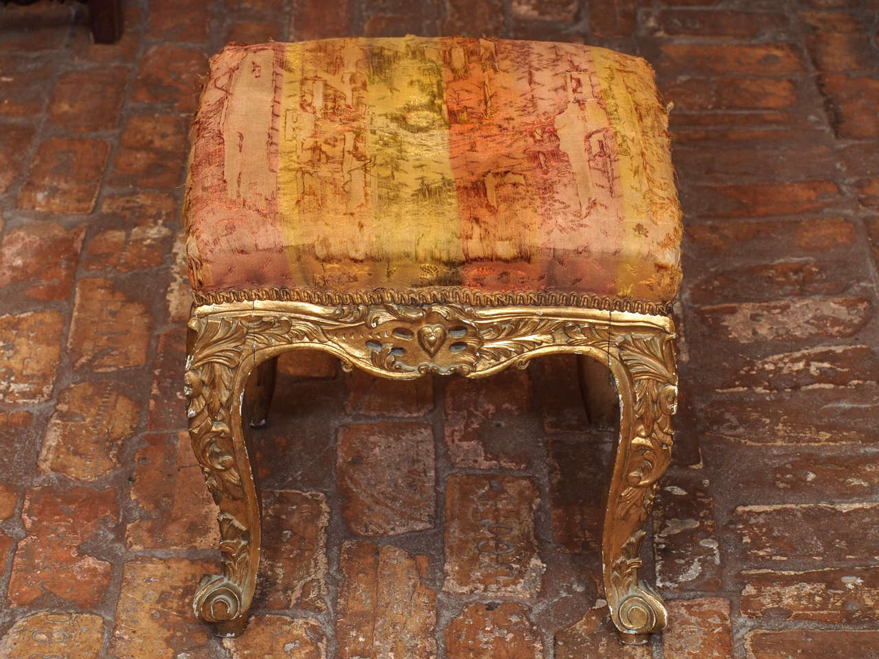 19th century French Regence style carved and gilded tabouret