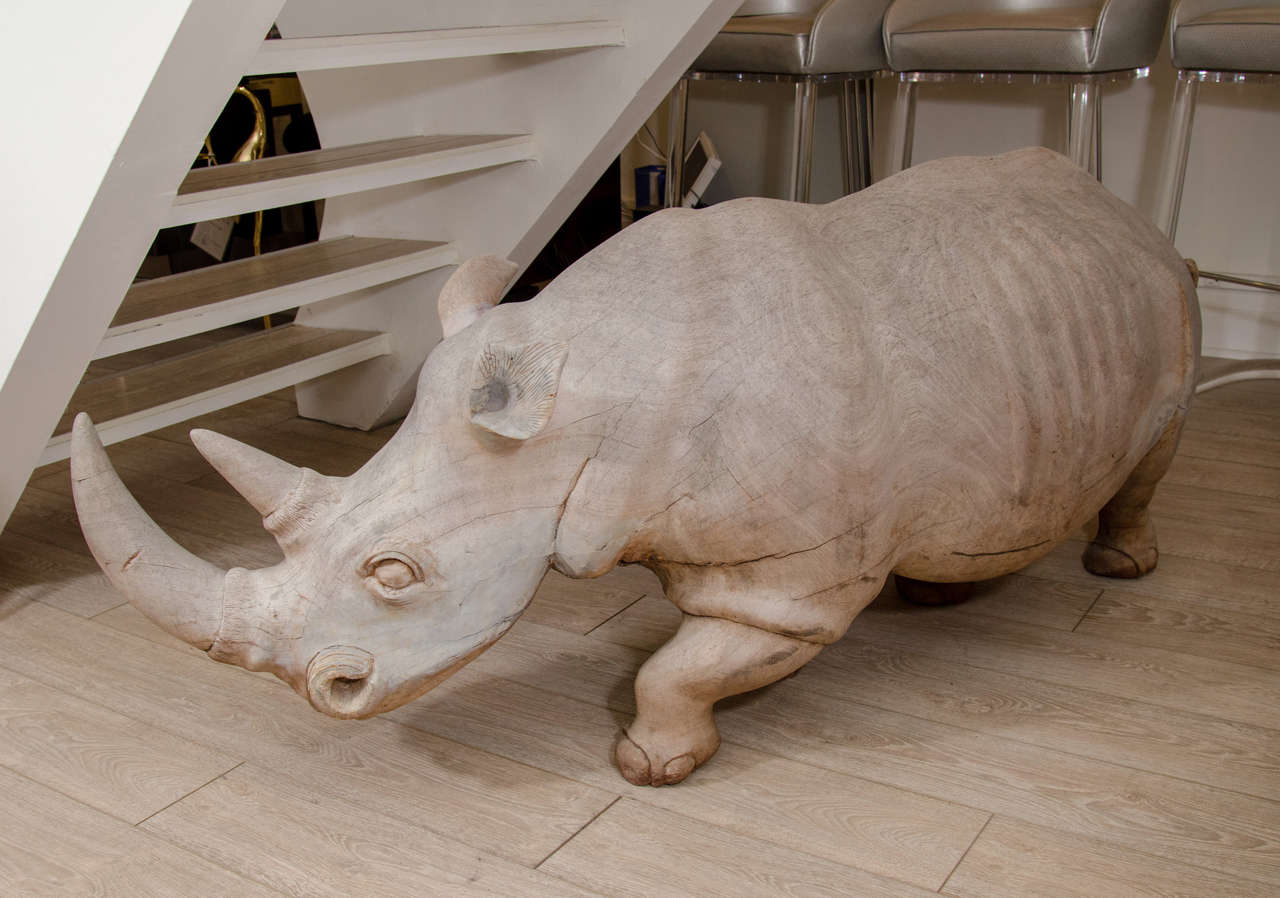 Monumental wood rhinoceros sculpture.