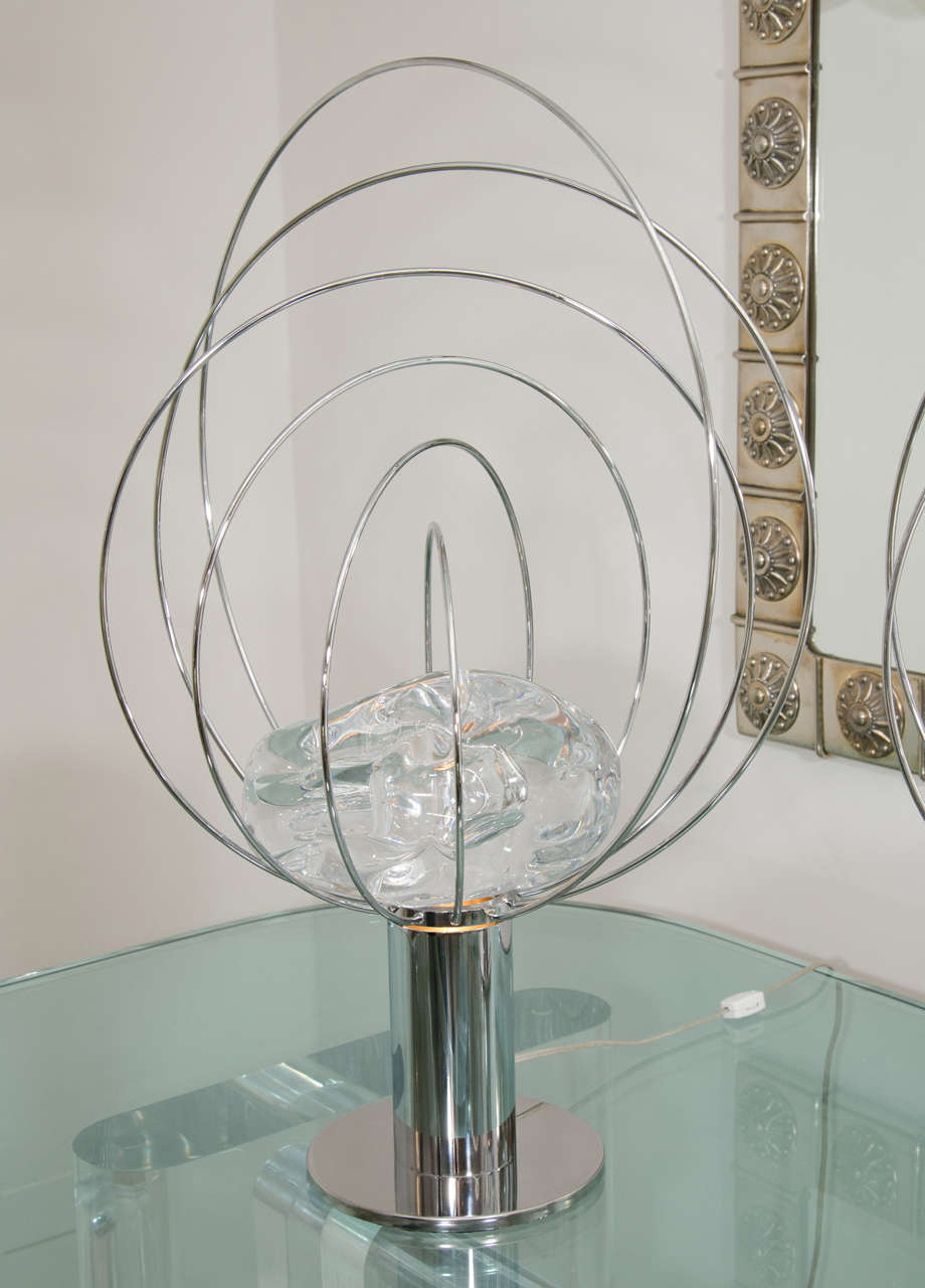 Pair of chrome orbital form lamps with illuminated rock crystal center by Angelo Brotto.