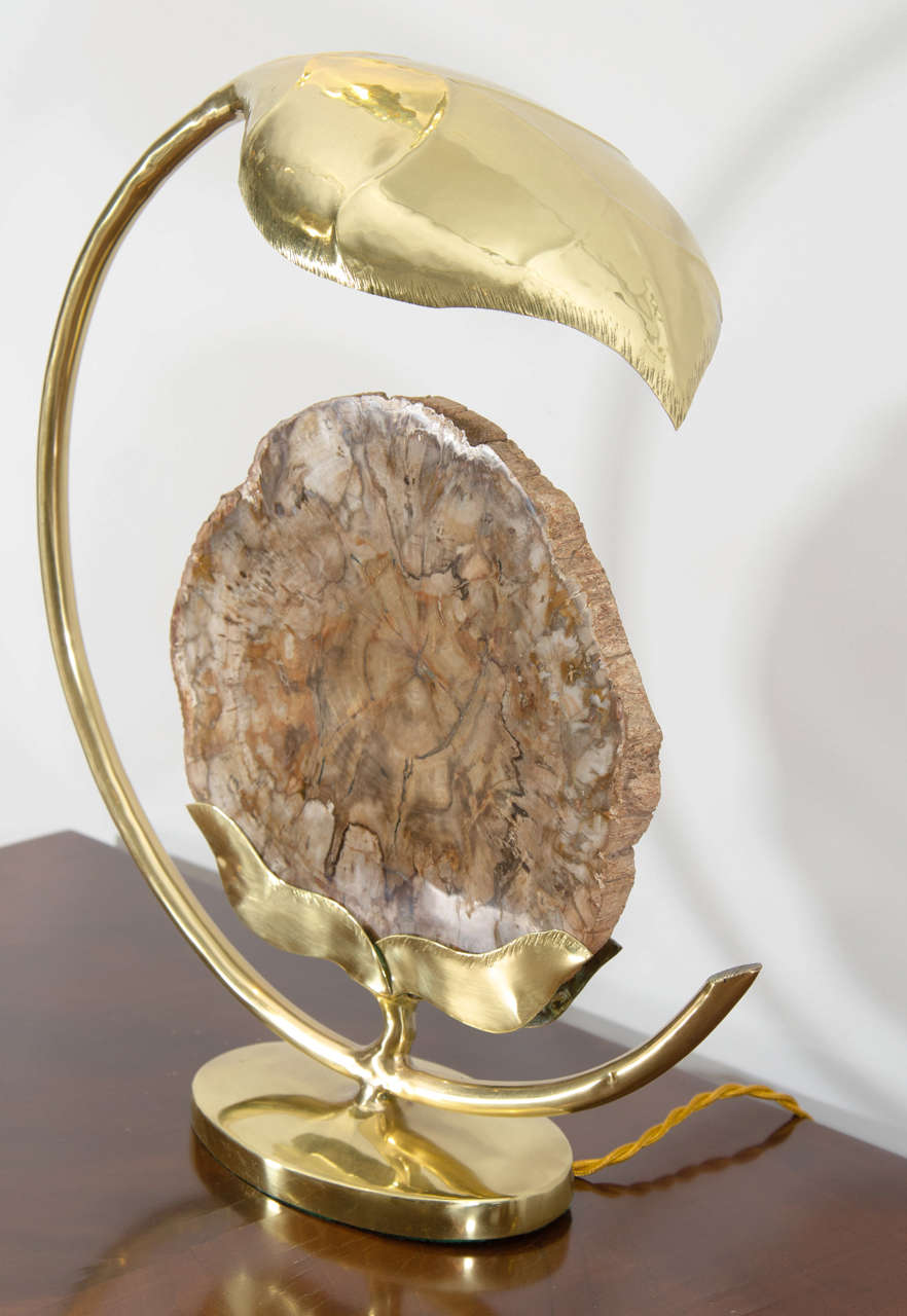 Amazing figurative lamps in bronze and fossil tree slice, the light diffuses from the sculpted leaf. Rewired.