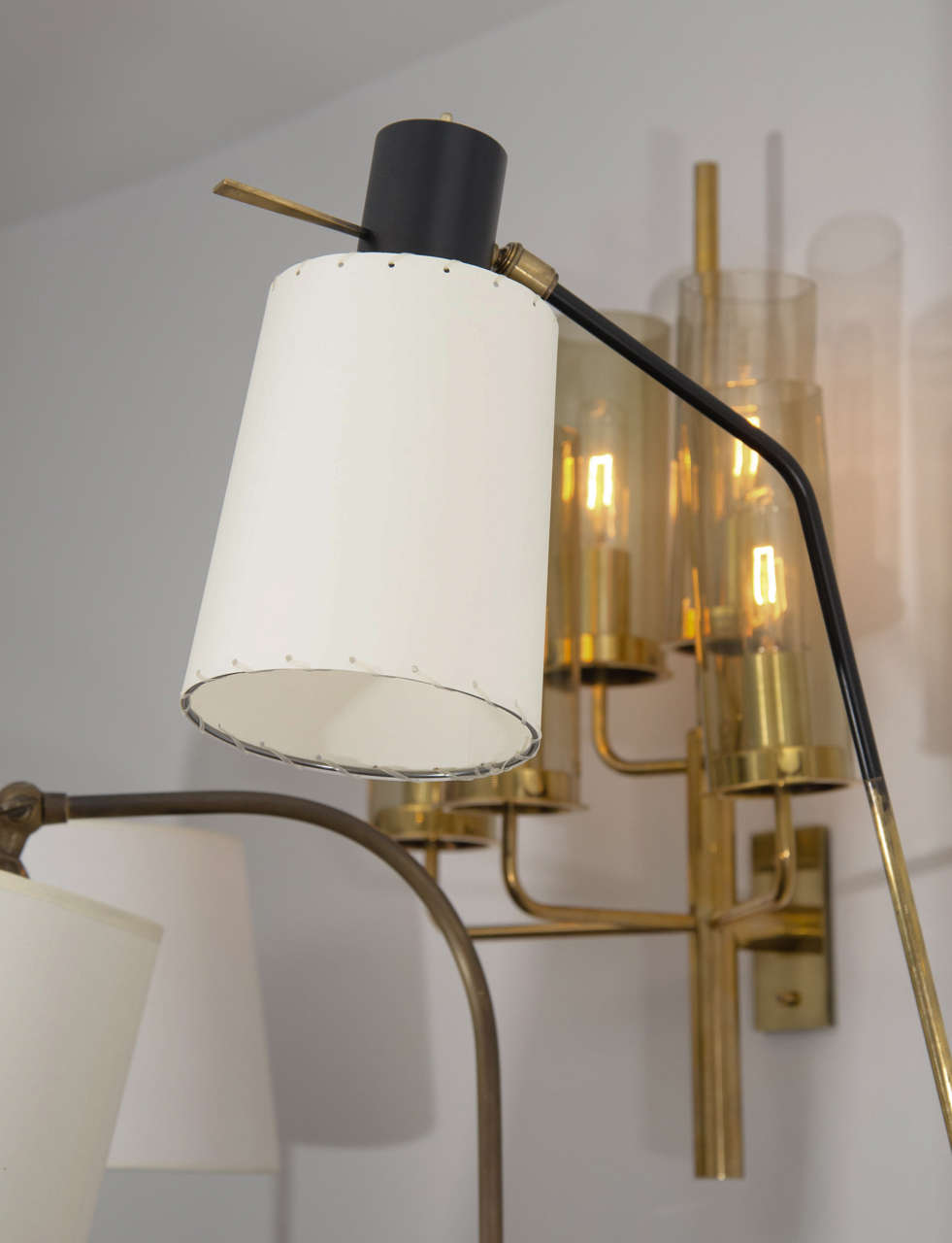 Upright sconces by Boris Lacroix with articulated shades. The stem moves horizontally and the shades with full range of motion. Brass with black powder coated details and new shades.