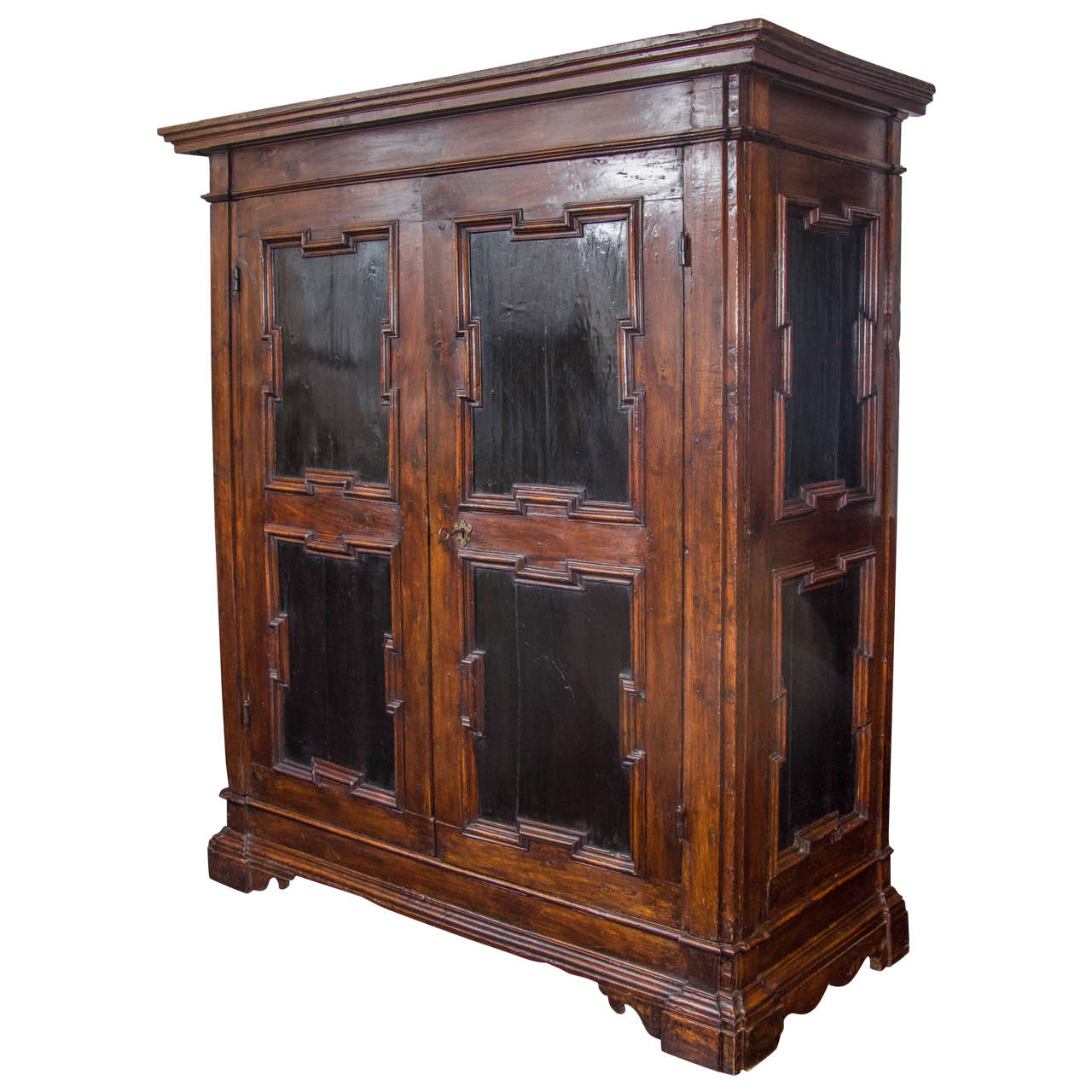 A large scale 18th century Italian walnut armoire with very clean modernist details including raised panels on the front doors and sides. The interior includes a center shelf and potential hanging capabilities.
Can be dismantled for shipping and
