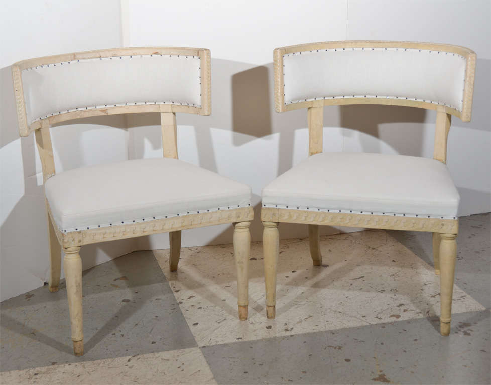 Beautiful pair of Swedish Gustavian Klismos chairs, paint has been completely removed and taken to the natural wood. Front legs are tapered, back sabered legs.