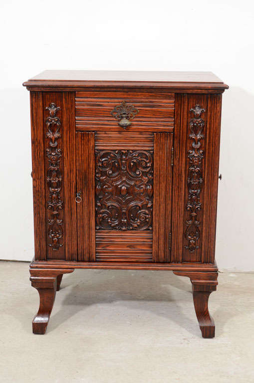 A beautiful and unique 19th century dry bar.The top is solid walnut wood and all the other parts are solid oak and finely crafted on the front door.It has three doors and one drawer.It's an excellent antique and could fit at any space.