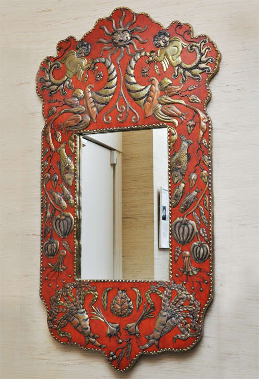 Wonderful mirror from San Miguel Allende. Burnt orange leather with hand-crafted metal fish and plants.