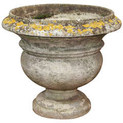 A Weathered, Footed Garden Urn
