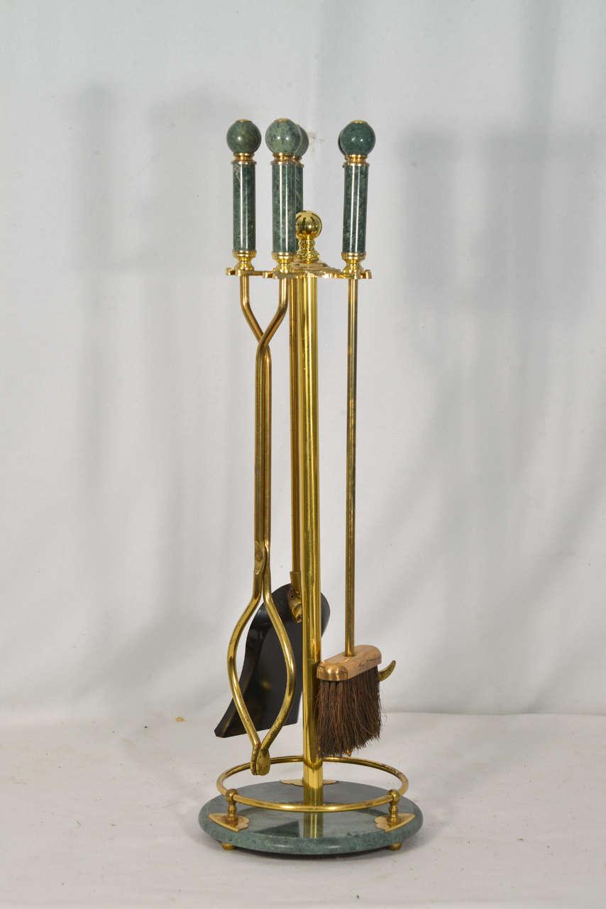 Vintage fireplace tools, green marble handles and base with polished brass support. Five tools, (tongs, brush, poker, shovel, stand).