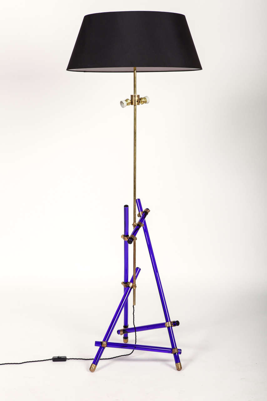 a big floor lamp, colored galss rods, tubular brass, brass fabric lampshade;this model is very similar to the model produced by Max Ingrand for Fontana Arte in 1957 for the table lamp; 
no documents about the production by  Fontana Arte of this