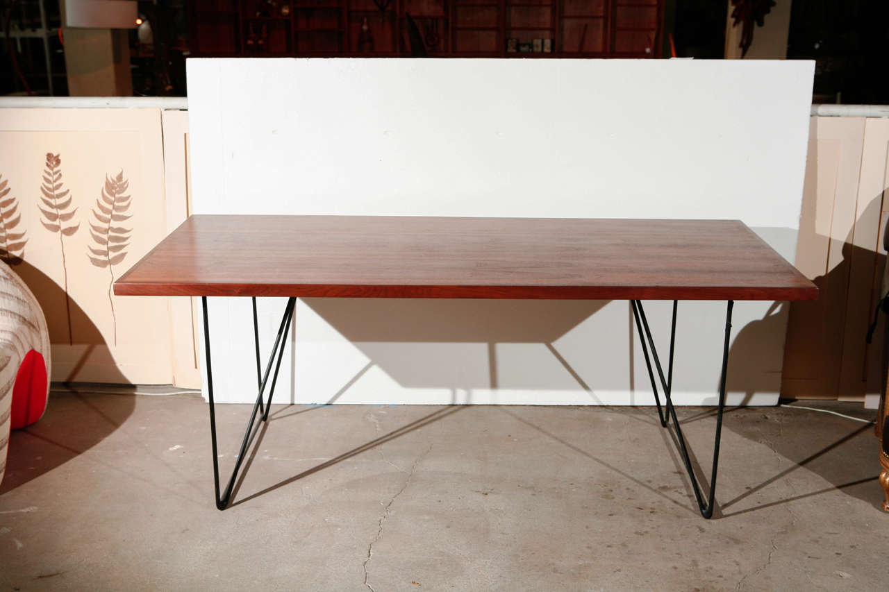 Luther Conover walnut top and enameled steel leg table.