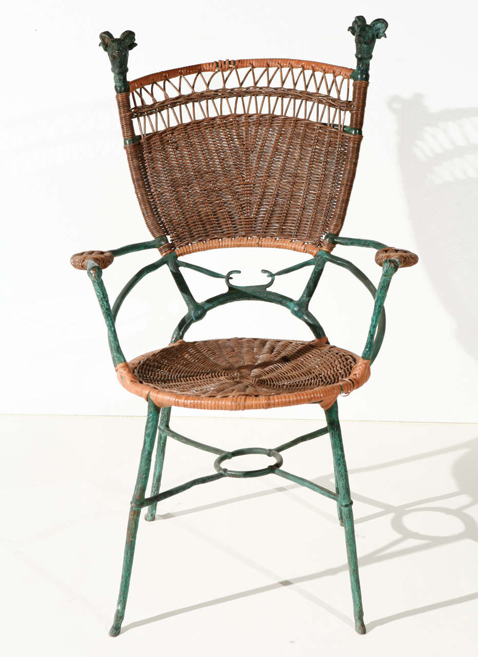 pair of bronze and cane armchairs in the style of Diego Giacometti