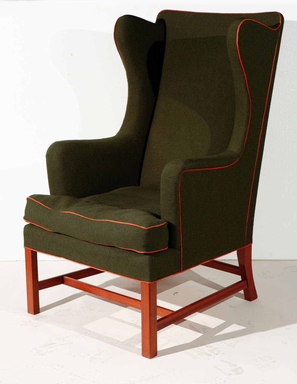 Kaare Klint green fabric upholstered and leather trim wingback chair