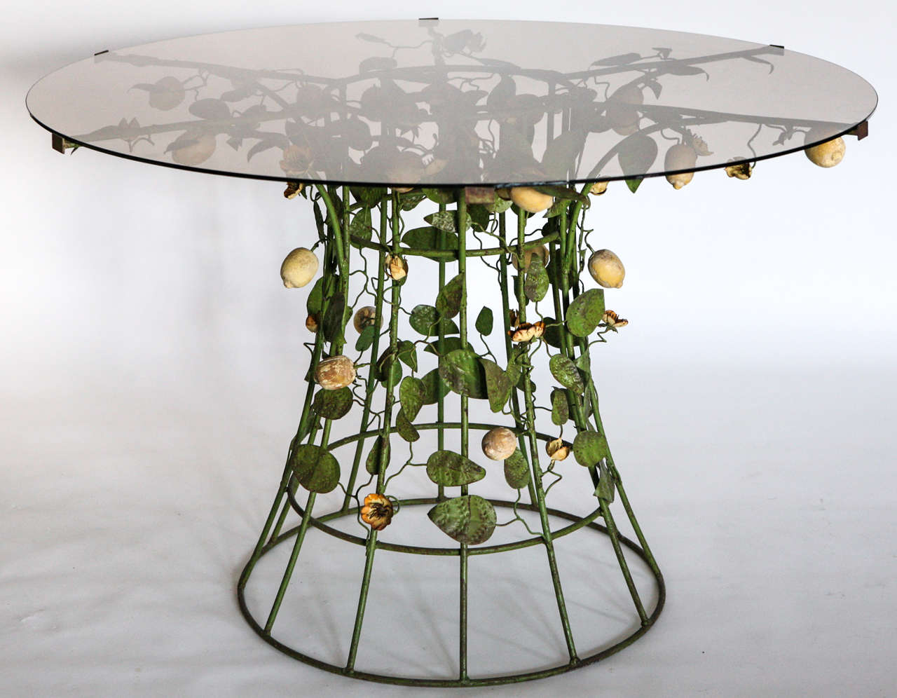 Handmade tole lemon vines, flowers and leaves adorned with carved, painted wood lemons. Replaced smoky glass top.