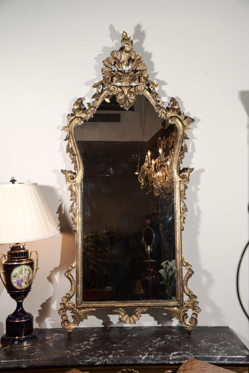 pair of late 19th c to early 20th c Italian Louis XV carved and gilt mirrors