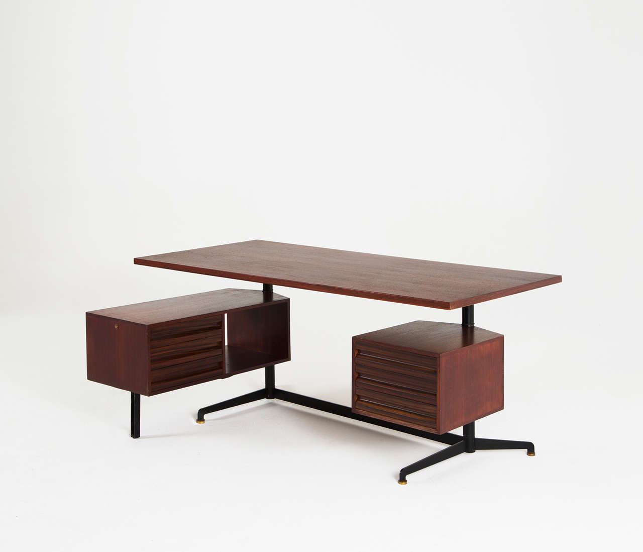 Rare desk by Osvaldo Borsani in rosewood, very early, 1950s. 

The frame is made of black steel and is provide with elegant solid brass toes. The large functional tabletop is made of rosewood. Accompanied with several swiveling drawer compartments