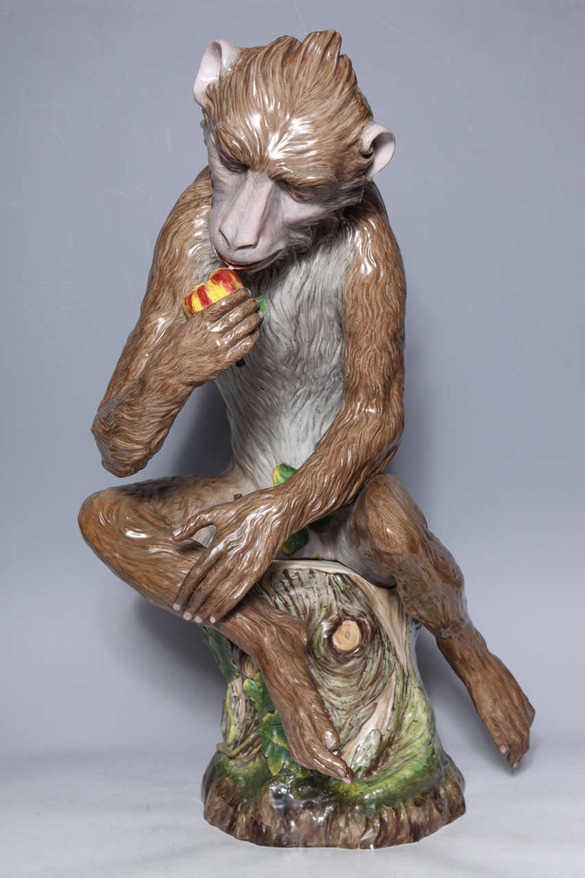 An important Meissen porcelain life-size seated monkey figure by J. J. Kandler with provenance from the Vanderbilt collection. Cobalt blue crossed swords mark inside the bottom of the tree stump. This highly detailed and exquisitely lifelike carved