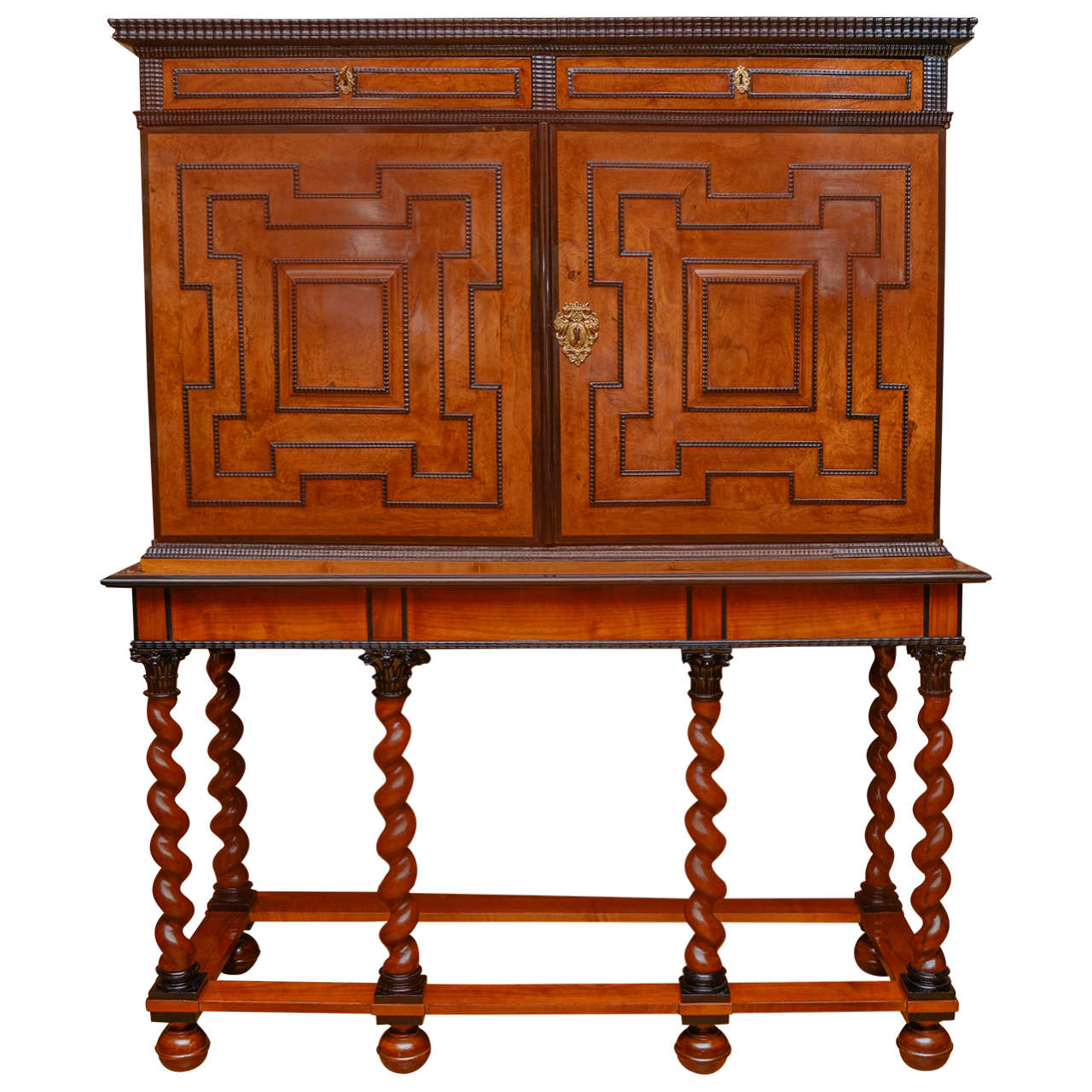 Very nice olive wood, walnut and ebony parquetry.
Opening by two big doors containing 26 drawers and two little doors with columns and capitals. The stand is not antique.