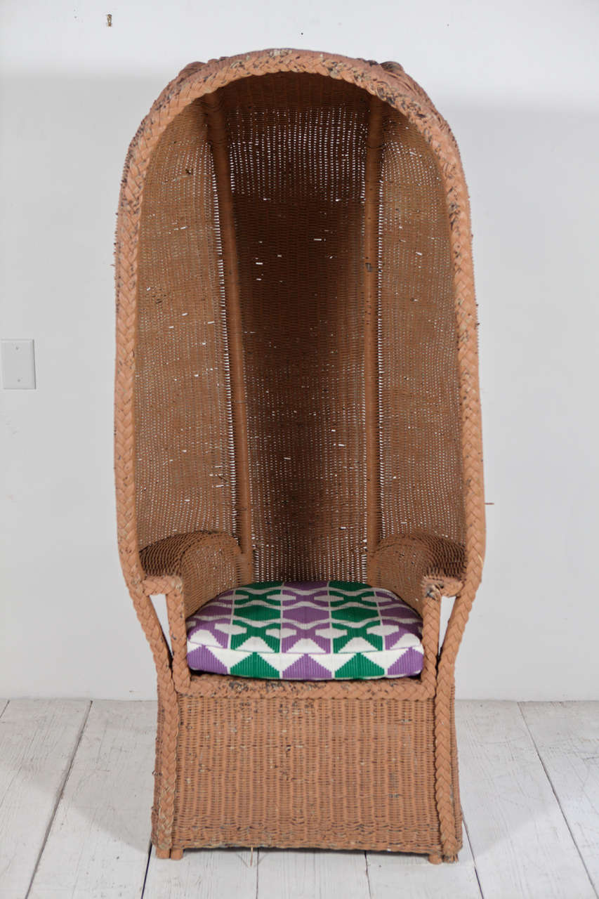 Excellent indoor or outdoor chairs with dramatic hood. New cushions in vintage African fabric.