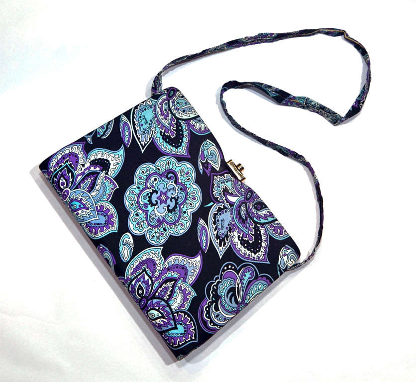 funkyfinders selected this purse from our vintage pucci collection as its not often we 'find' a shoulder bag by this fashion house. this happy gem features a stunning flower-power print with a hint of paisley. striking hues 'pop' on a black