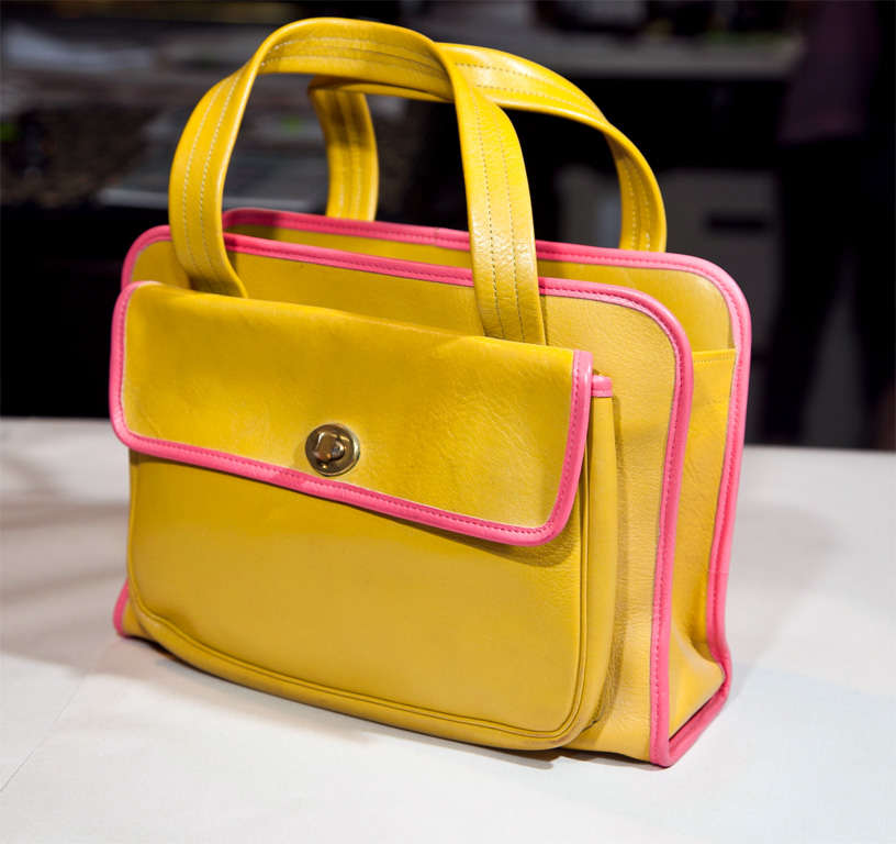 15 years ago, this piece was a contender for the archive of donna karan or the studio of funkyfinders.com. well: it has become our 'fashion feature'. outstanding leather, colorblock neon pink piping amidst a neon golden yellow surround make this