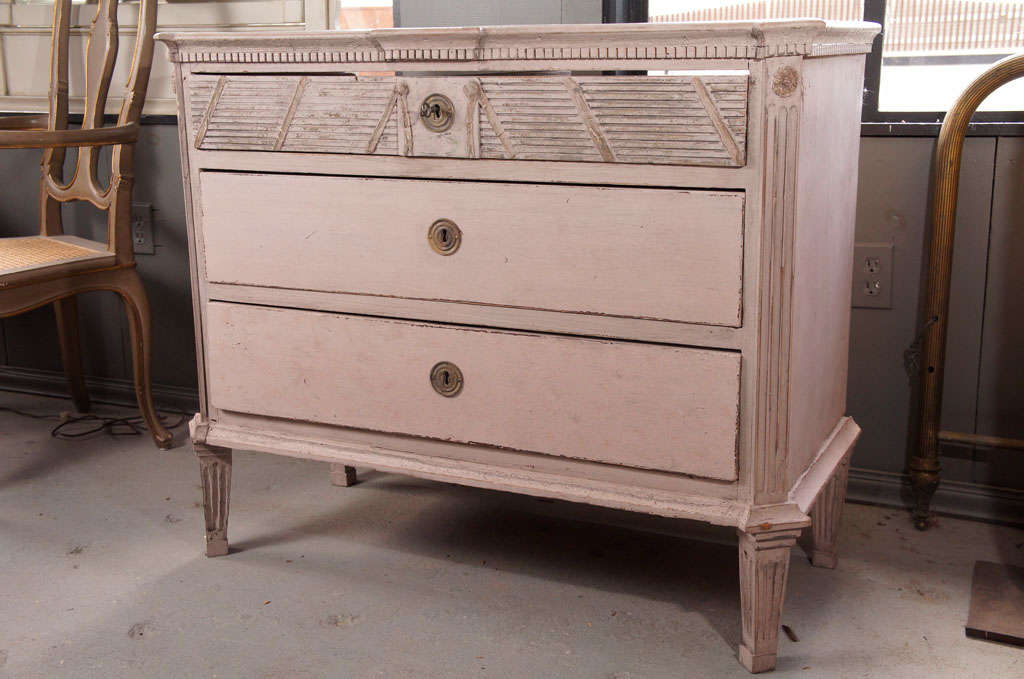 Swedish Gustavian Louis XVI period painted chest of drawers with raised reeded detail , three drawers and dental molding around the top.

Louis XVI style COD,