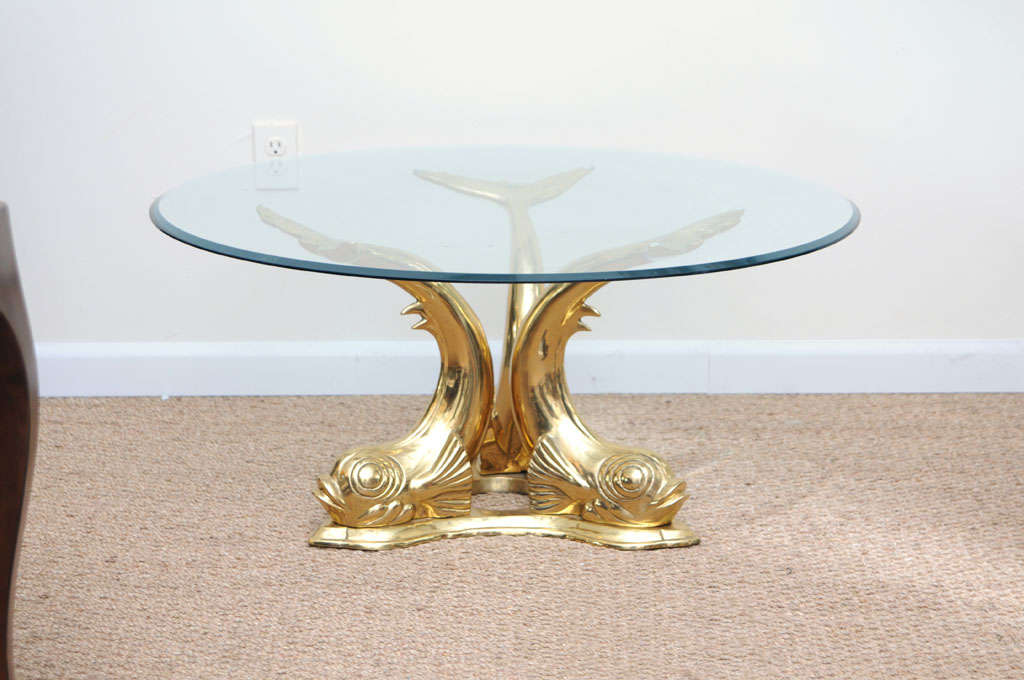 Solid cast brass coffee table that makes a glamorous statement.
Beveled glass top.