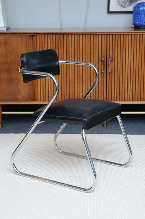In the style of a design by Gilbert Rohde, this chair produced by the Royal Metal Manufacturing Company with showrooms in New York, Chicago and Los Angeles. A wonderful desk chair, side chair and armchair, it sports the original upholstery and the