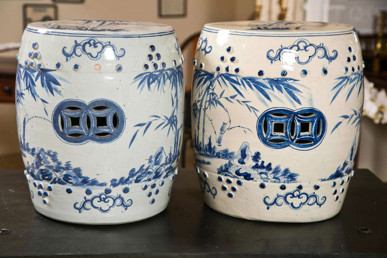 Lovely pair of blue and white Asian style garden seats hand painted with bamboo motif.