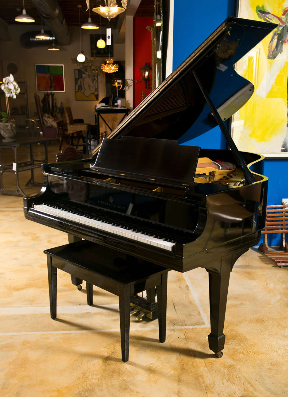 Circa 1931 Steinway M with matching bench, completely rebuilt and in beautiful condition. Excellent sound.