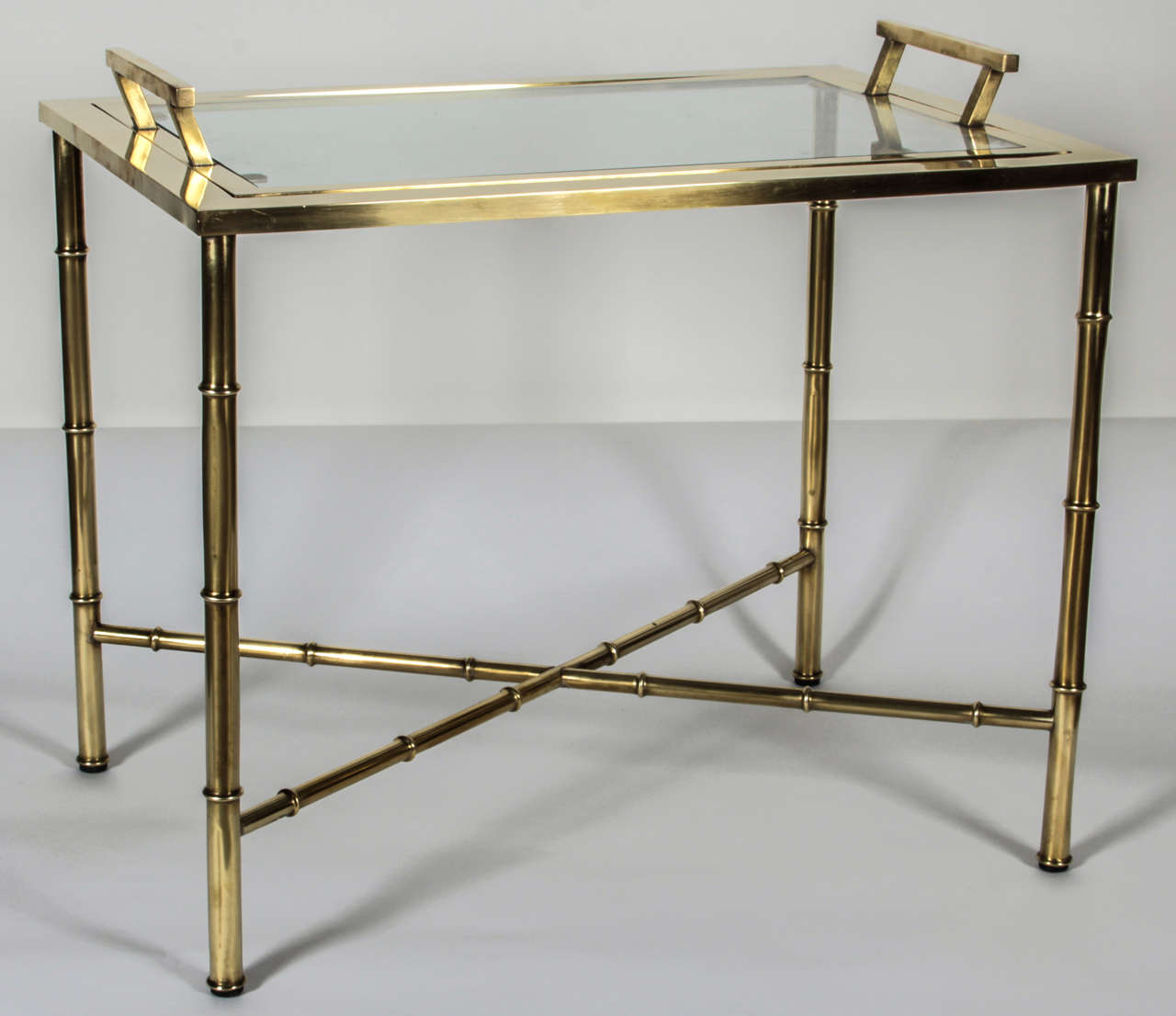 Faux bamboo legs and cross stretchers support a polished brass frame holding a removable glass serving tray. Fine Italian craftsmanship. Paper 