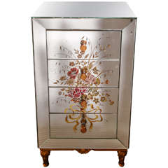 Charming commode with 4 drawers and eglomised mirror .
