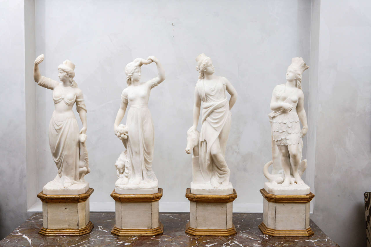 Early to mid 19th century very fine and rare Italian Carrara Marble Statues/Sculptures depicting the four Continents. They are mounted on (later date) giltwood and painted bases.