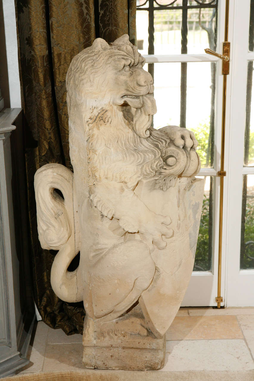 A magnificent pair of 18th century French Hand Carved Limestone Lions. The base measurement is 11.5 inches.