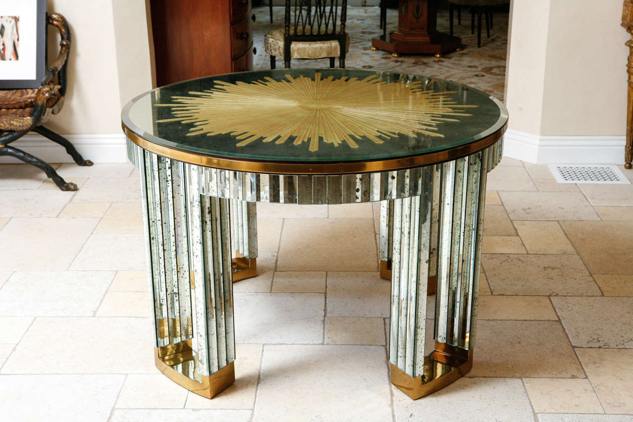 Stunning Vintage Mirrored and Brass Center Table with Gilded Etched Starburst Top.  The table is from the Helena Rubinstein Salon.  Attributed to Maison Jansen, Paris.  One table has sold. There is one table remaining and available for purchase.