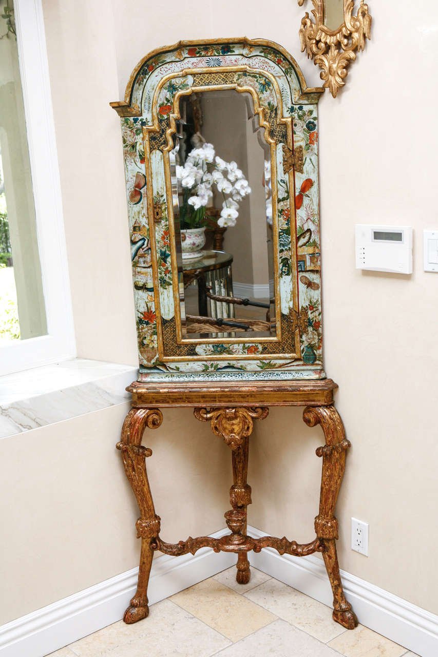 Pair of stunning 18th century English Chinoiserie Mirrored Corner Cabinets on original Giltwood bases.  Very fine hand painted colorful detail.  Original keys are included.