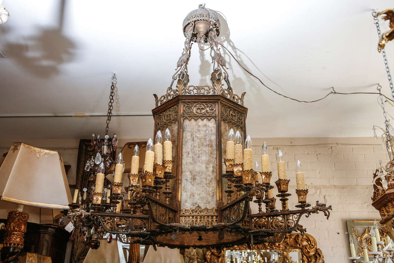 1920s Oscar Bach Oversized 24-light large Chandelier with Gilded Bronze, Iron and Giltwood.  Very rare and fine. This chandelier has been newly wired.