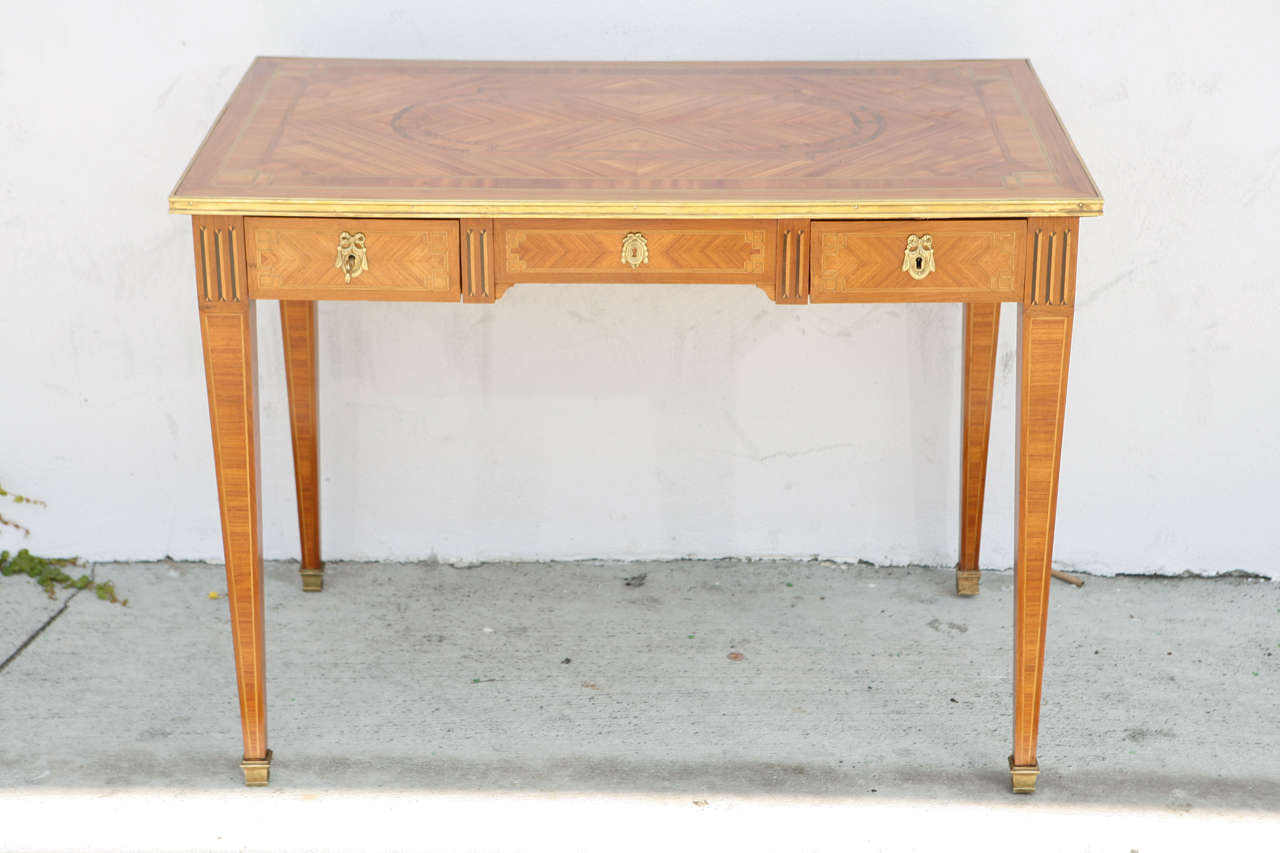 19th century two-Drawer Writing Table/Desk.  It is bronze mounted and is very finely inlaid.  Original keys are included. Signed by maker:  A. Dubouis  Paris.