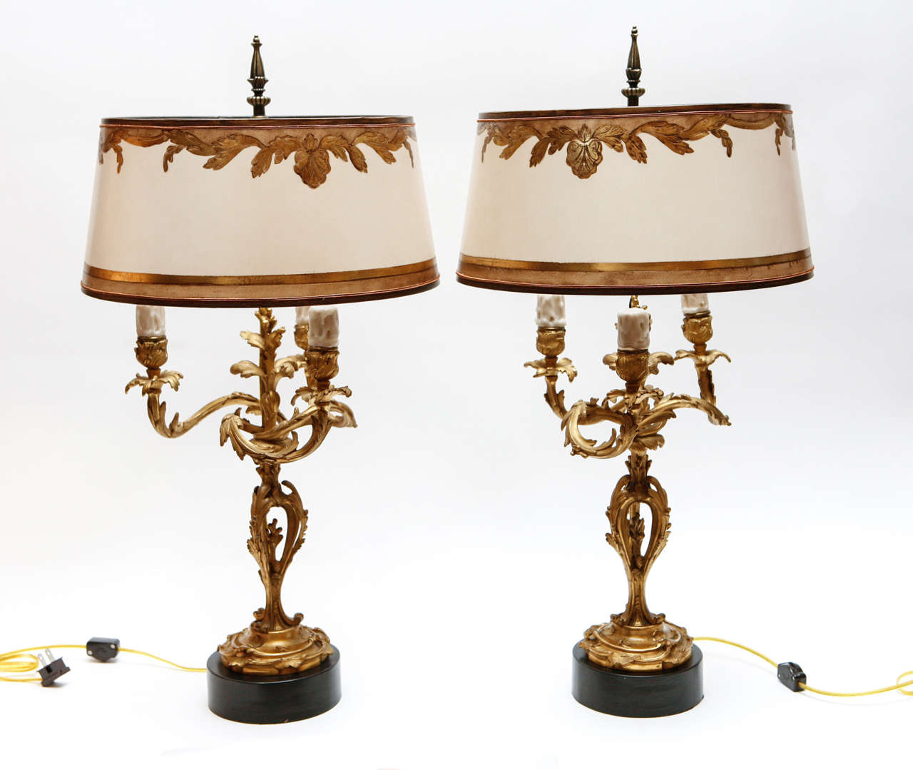 Pair of 19th c. French Candelabras that have been converted to lamps.  They are Dore Bronze with very fine chasing. The Shades are included and are Hand Made of Parchment Paper. They are Hand Gilded and Decorated. The lamps have been newly wired.