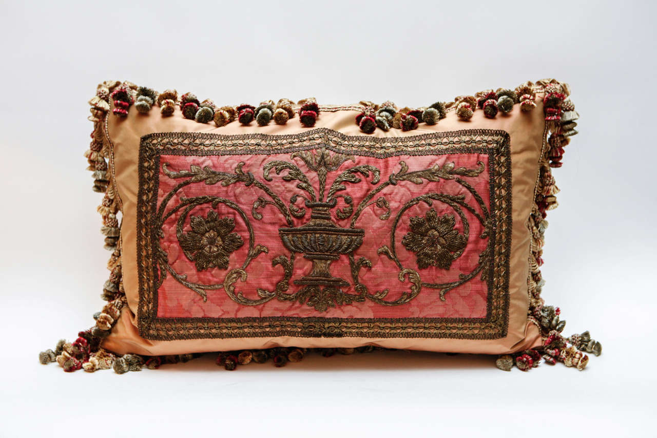 Pair of 18th c. French Fragment Pillows. The Lyonnais metal thread tapestry fragments have been meticulously restored and masterfully sewn onto silk fabric to create these beautiful pillows. Decorative tassel silk trim has been applied to finish the