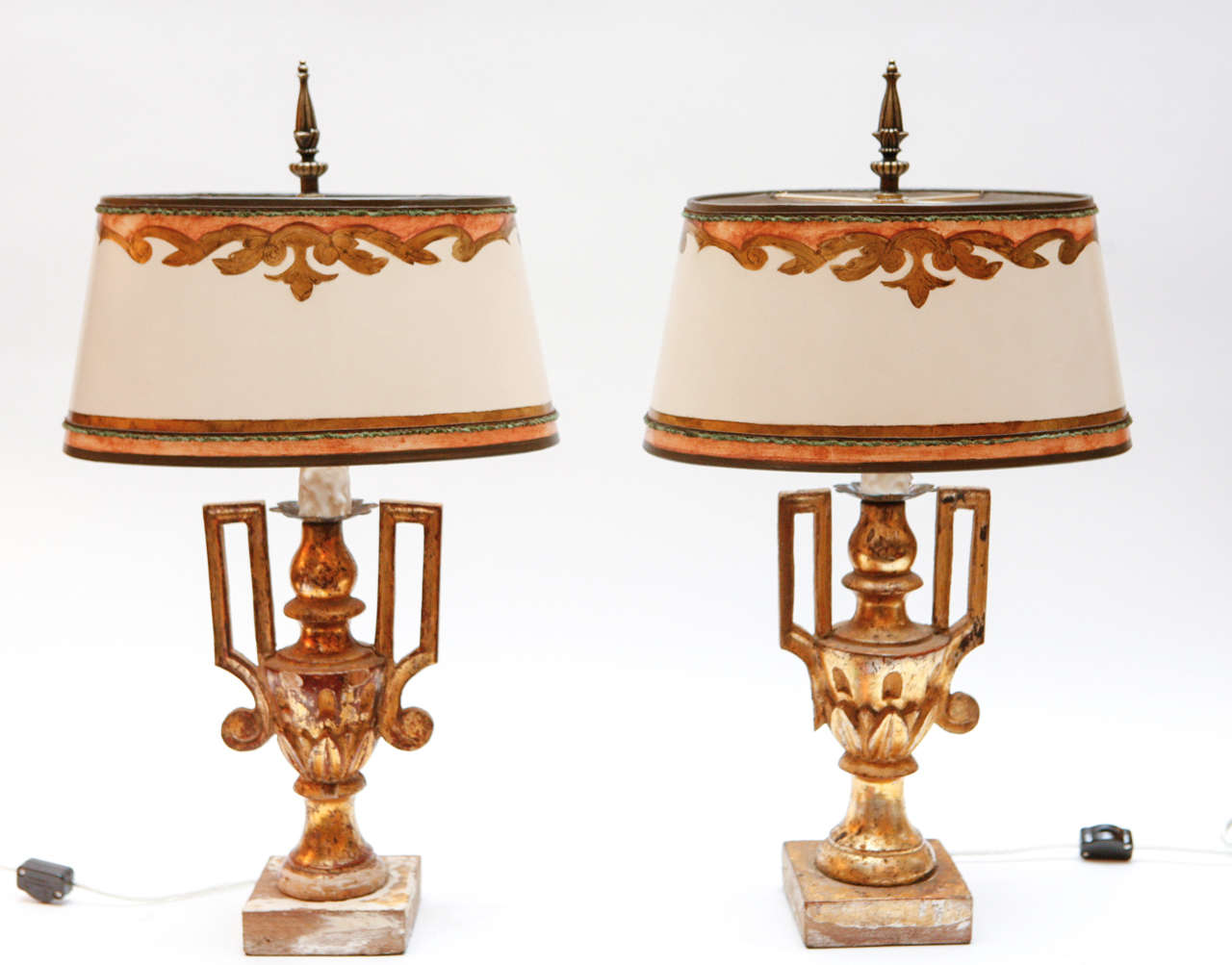 Pair of early 19th c. Italian Giltwood Urns converted to lamps. The Shades are included and are Hand Made of Parchment Paper. They are Hand Gilded and Decorated. The lamps have been newly wired. The measurement to the top of the finial is 21.5
