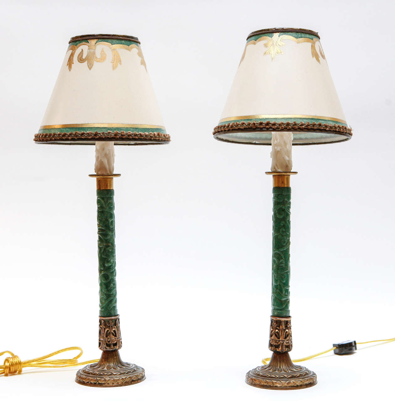 Late 19th c. French Green Nephrite Candlesticks converted to lamps.  They are French Bronze Mounted and finely carved. The Shades are included and are Hand Made of Parchment Paper. They are Hand Gilded and Decorated. The lamps have been newly wired.
