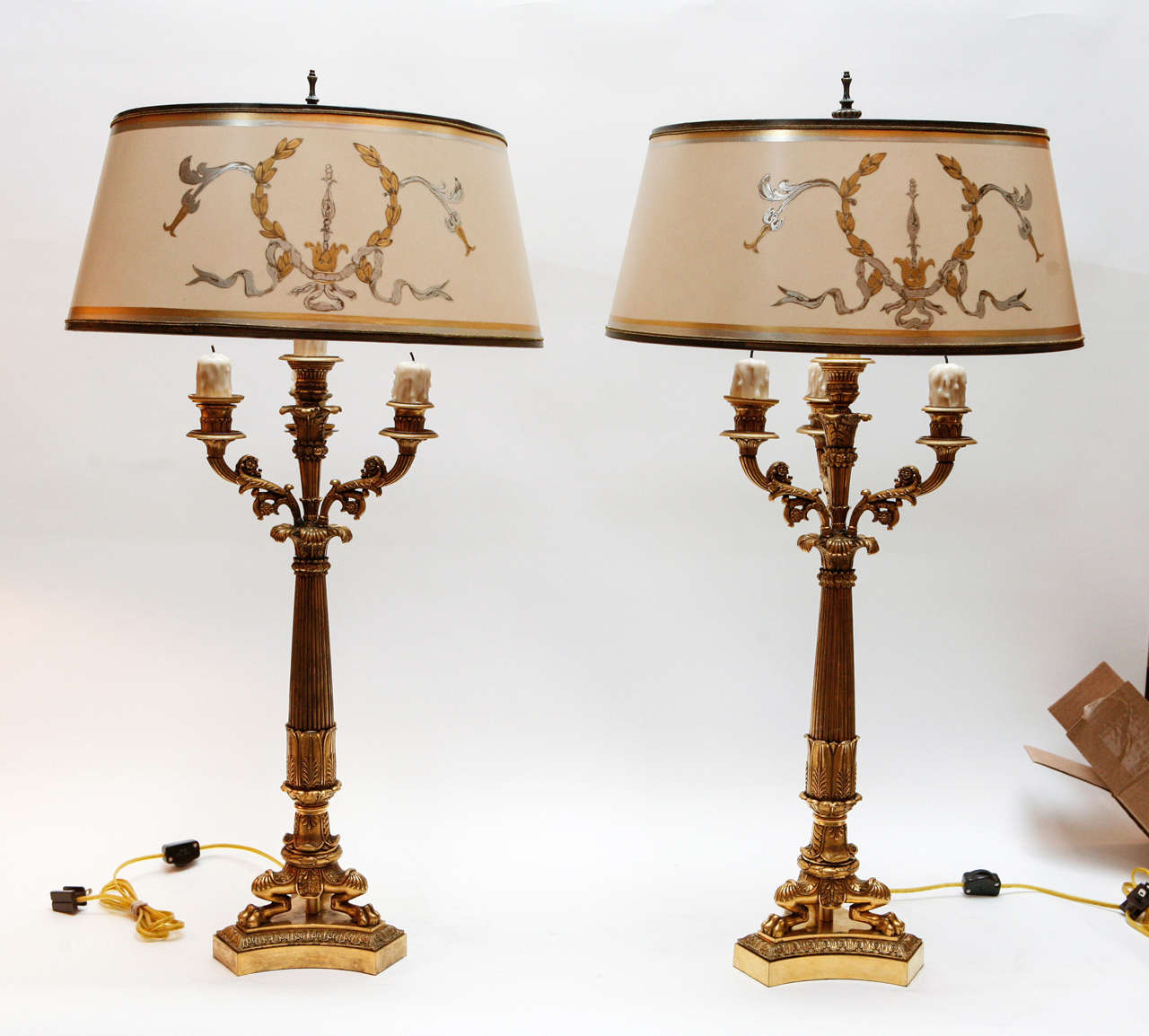 Pair of 19th c. French Empire Dore Bronze Candelabras converted to lamps. They are very finely chased. The Shades are included and are Hand Made of Parchment Paper. They are Hand Gilded and Decorated. The lamps have been newly wired. The measurement