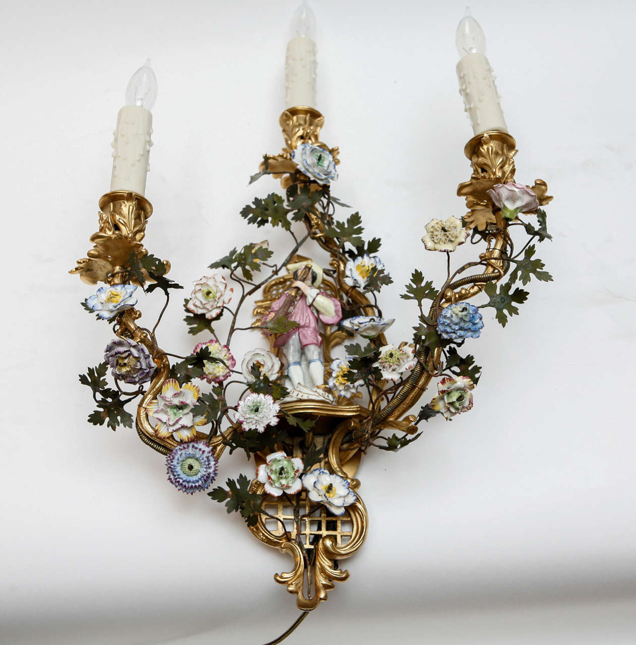 Pair of 19th c. French Porcelain Sconces with very finely chased bronze and hand painted flowers/figures and tole leaves. the sconces have been newly wired.
