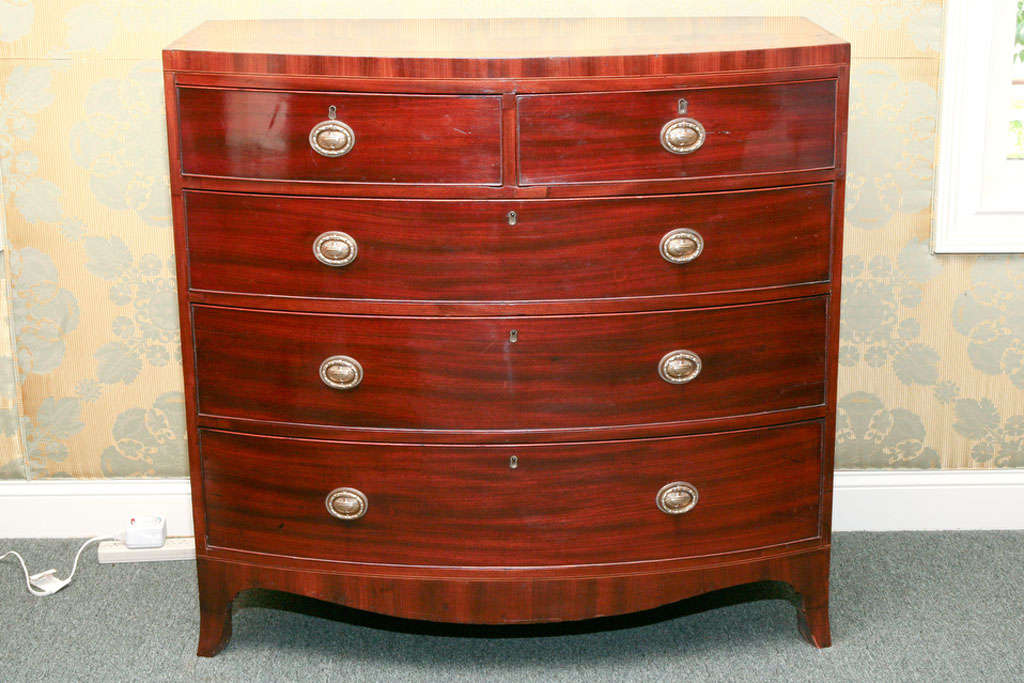 George III mahogany cross-banded bow front chest of drawers