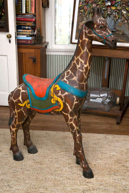 HAND MADE AND HAND PAINTED WOOD GIRAFFE FOR AMUSEMENT PARK
CAROUSEL- MADE IN AFRICA AROUND 1920 OF MAHOGANY WOOD- CAN HOLD 
CHILDREN