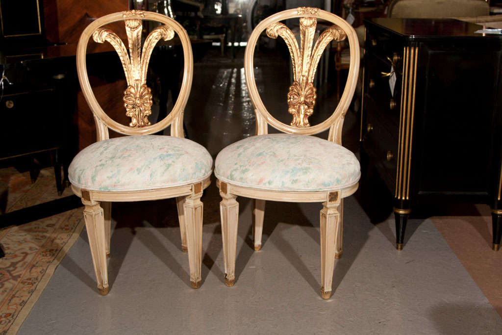 Set of six French Louis XIV style dining chairs, circa 1940s, crème peinte and parcel-gilt plume back-splat, later upholstery. Stamped Jansen.