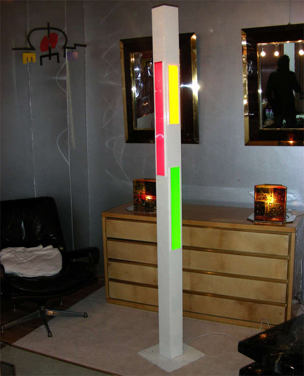 1980s floor lamp in white metal and red, orange, green and blue plexiglass. Signature difficult to read (Joël Donjon ?), numbered 16/250.