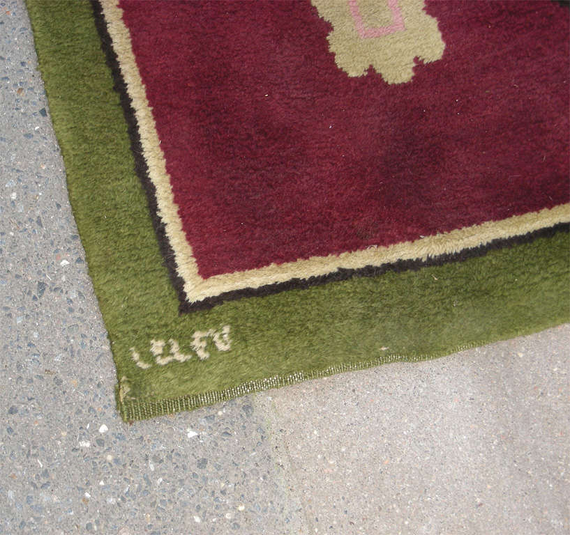1950s carpet signed by Jules Leleu, in wool, with geometric patterns.
