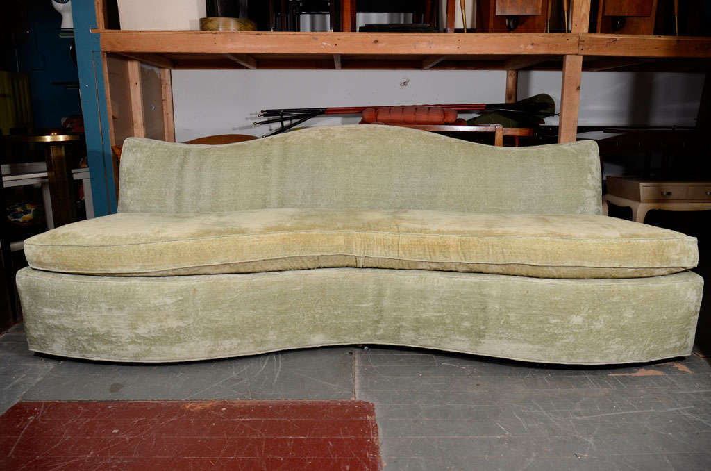 Curvaceous sofa upholstered in original fabric designed by Rose Cummings, American 1940s.